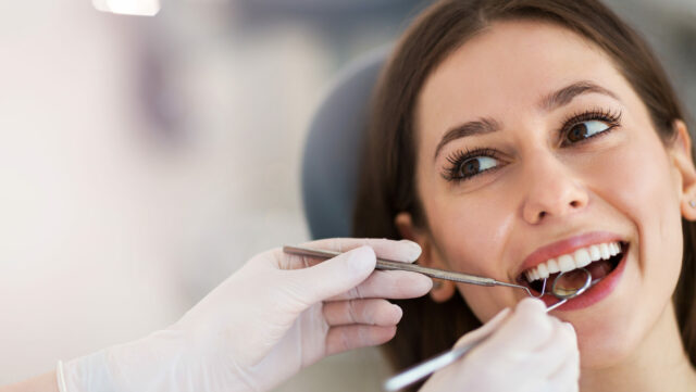 Woman,Having,Teeth,Examined,At,Dentists